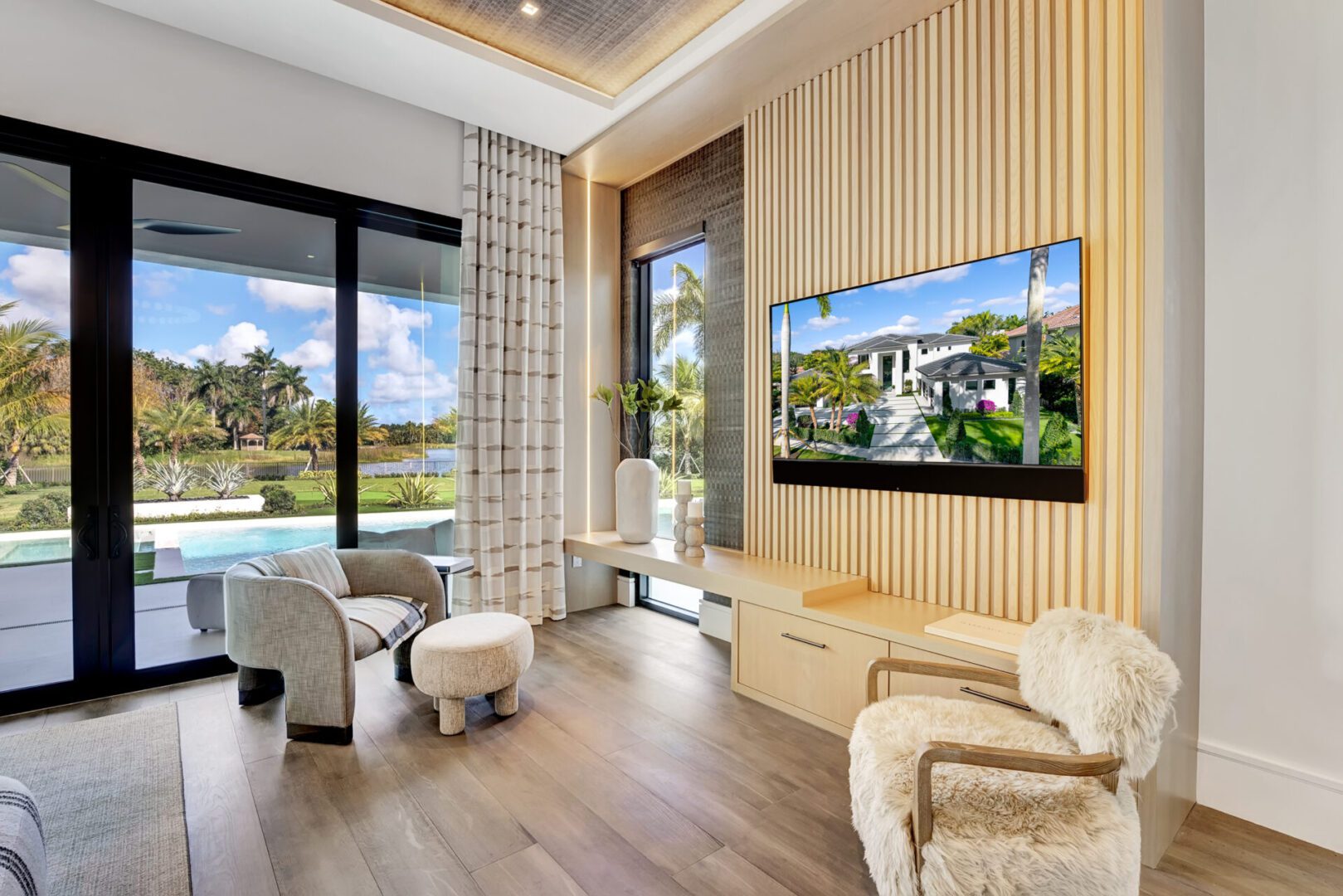 A living room with a large flat screen tv.